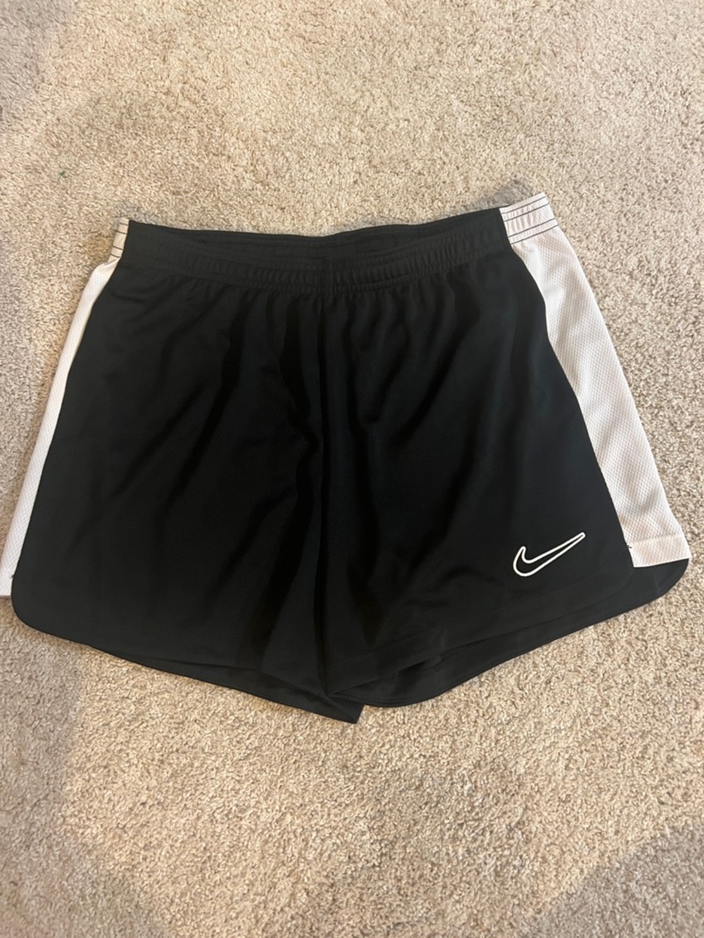 Nike Women's Black Athletic Shorts with White Side Panels and Swoosh
